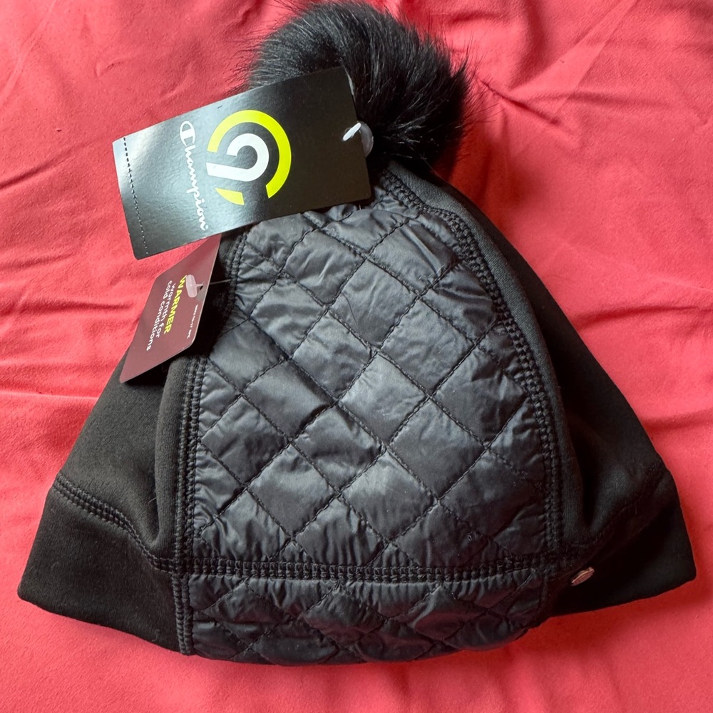 Champion Black Quilted Beanie w/ Pom. Brand new with tags. Circumference is 23”